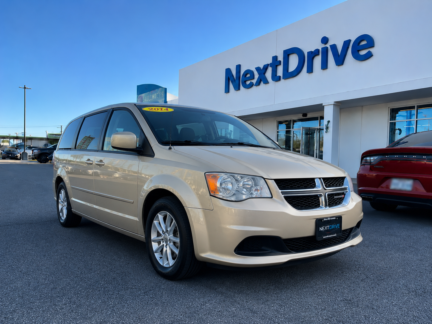2014 Sandstone Pearl 2014 Dodge Grand Caravan SXT — currently leased on contract